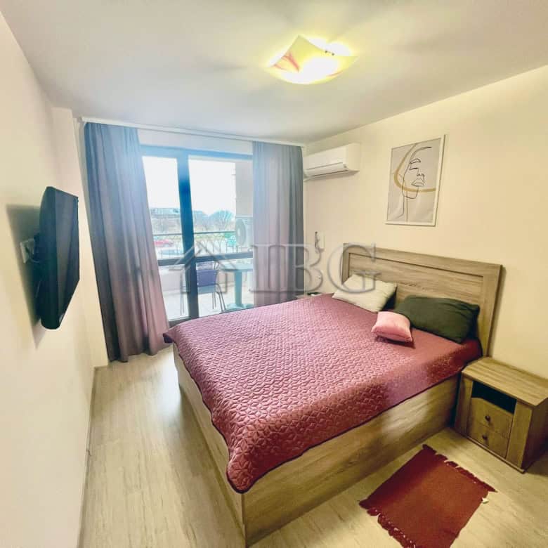 Spacious bedroom with sea view balcony in Burgas Beach Resort 2, Sarafovo. Modern furnishings and br.