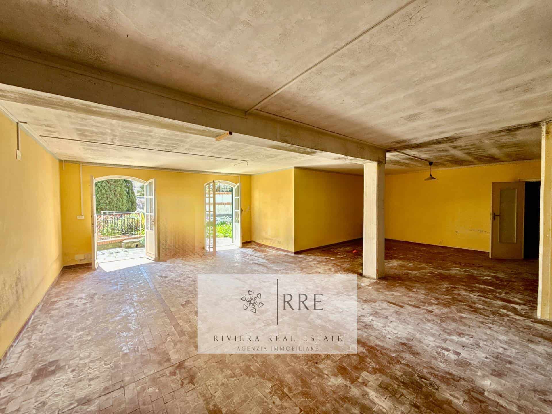 Bright, airy room with natural light and yellow walls, ideal for living or office space.