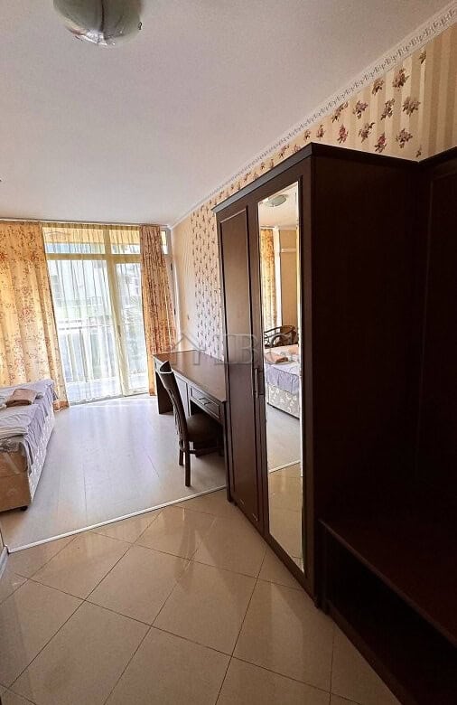 Interior view of a 2-bedroom apartment with pool and partial sea view in Sunny Beach.