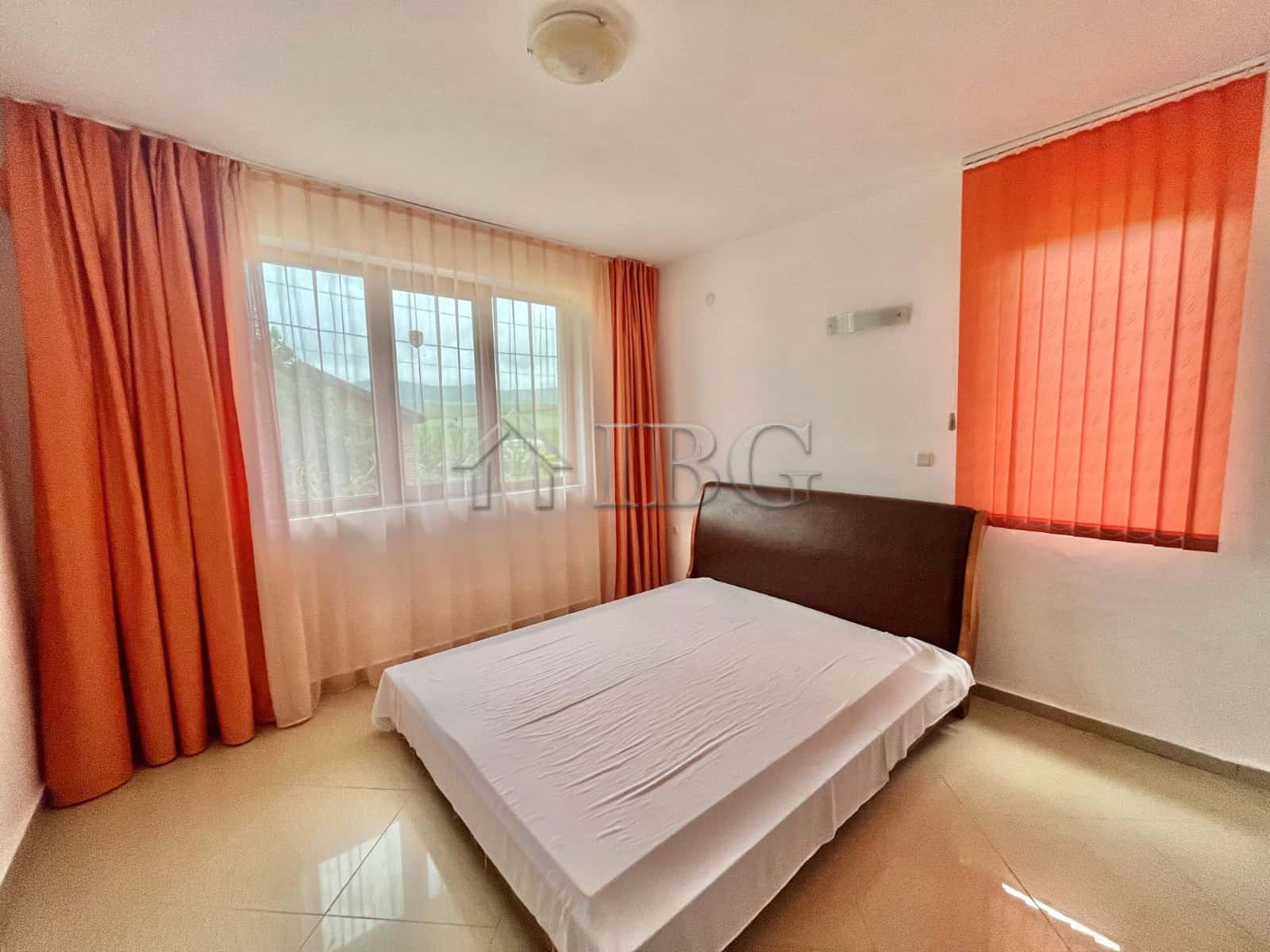 Bright bedroom with large windows and natural light in Aleksandrovo, Burgas.