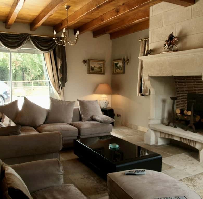 Elegant living room with fireplace in Dordogne Valley property.