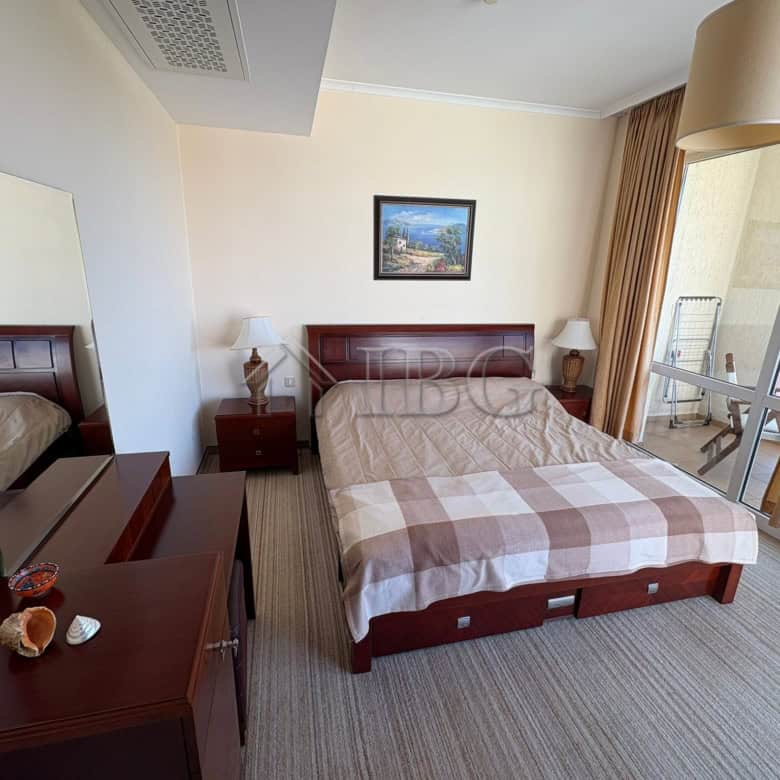 Bright bedroom with comfortable bed and modern decor in Sunny Beach.