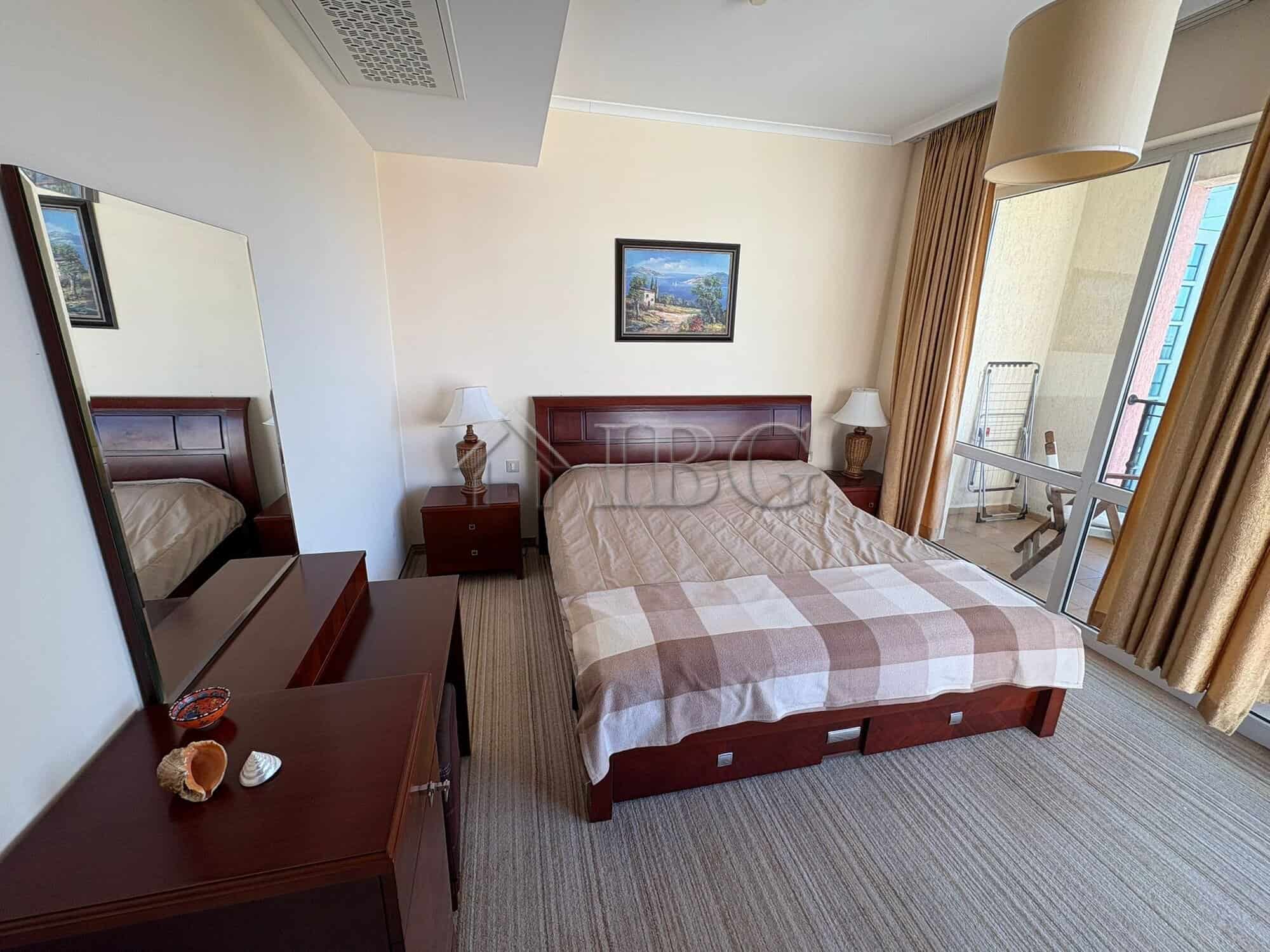 Bright bedroom with comfortable bed and modern decor in Sunny Beach.