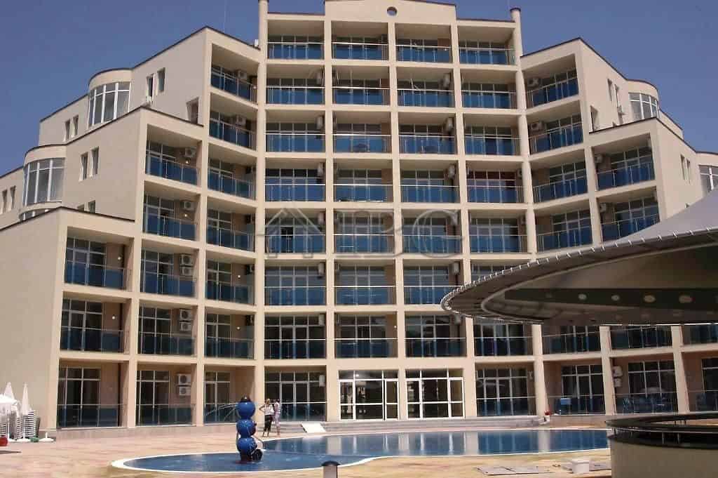 Apartment building in Sunny Beach with multiple balconies and contemporary design.