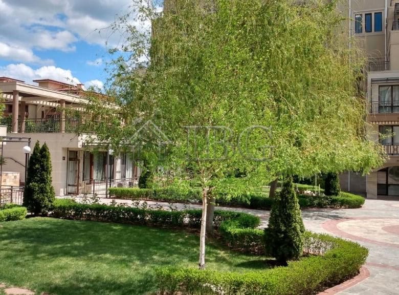 Exterior view of Sorento Sole Mare apartment complex with landscaped garden and trees in Sveti Vlas.