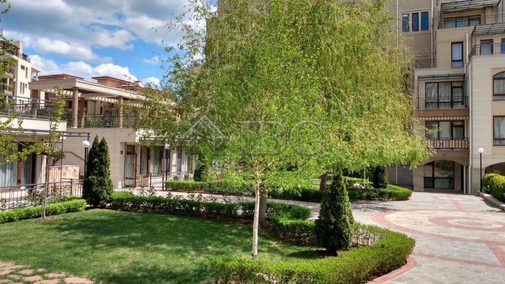 Exterior view of Sorento Sole Mare apartment complex with landscaped garden and trees in Sveti Vlas.