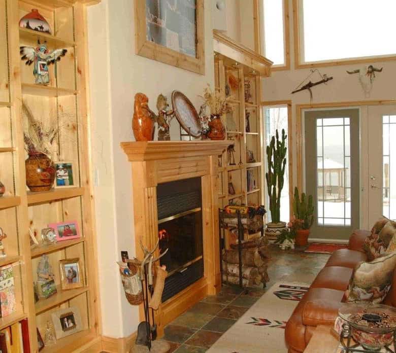 Ocean view living room with fireplace and cozy seating in Englishtown, Nova Scotia.