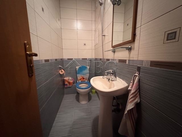 Bright bathroom with modern fixtures in Burgas apartment for sale.