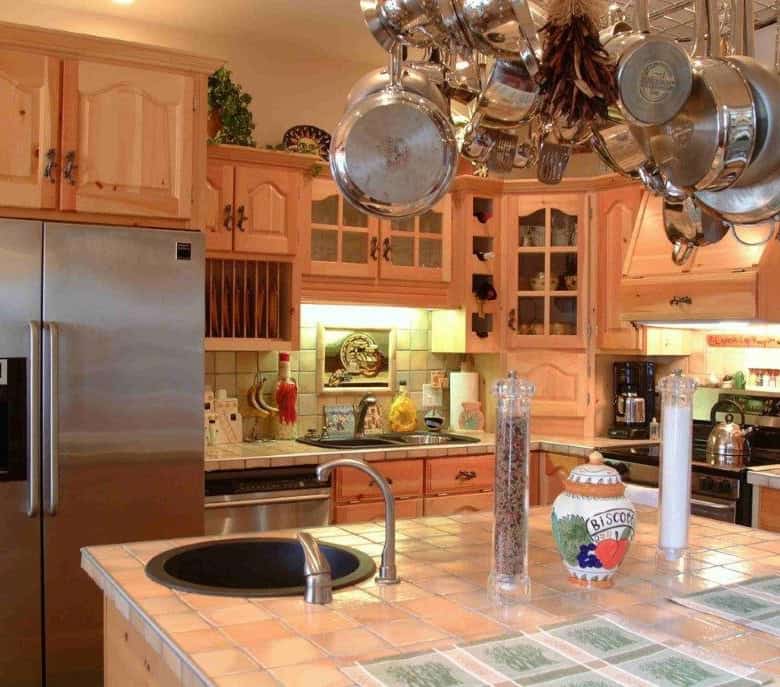 Bright kitchen with wooden cabinets and modern appliances in Englishtown, Nova Scotia.