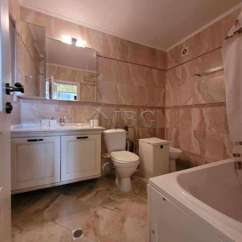 Elegant bathroom featuring a bathtub, toilet, and vanity in a high-end Sveti Vlas maisonette.