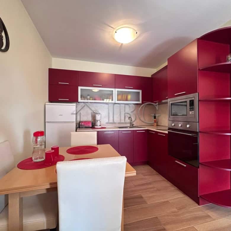 Modern 1-bedroom apartment with stylish red kitchen cabinets in Ravda. Perfect for comfortable livin.