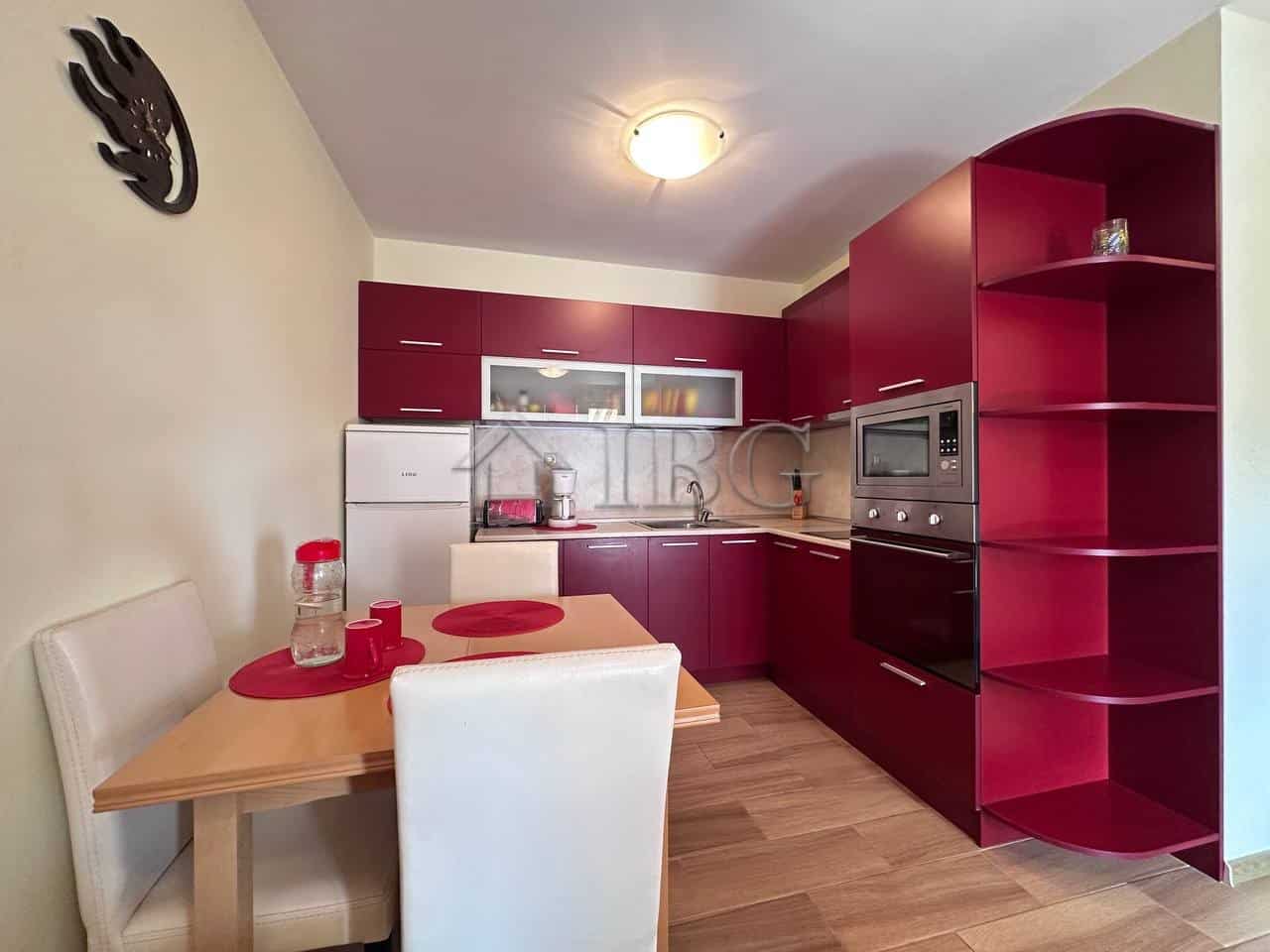 Modern 1-bedroom apartment with stylish red kitchen cabinets in Ravda. Perfect for comfortable livin.