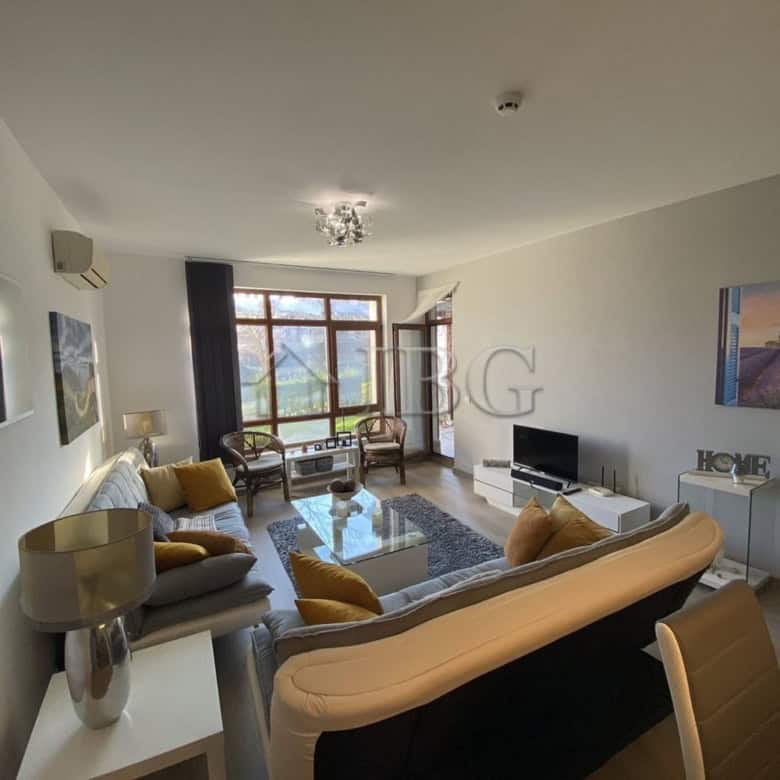 Bright living room with large windows and modern furniture in Vineyards Resort, Aheloy.