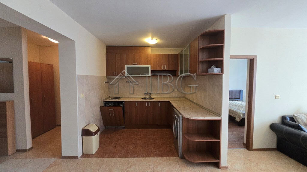 Spacious kitchen with wooden cabinets and contemporary appliances.