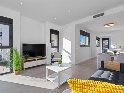 Spacious living room with large windows and contemporary decor in Santiago De La Ribera, Murcia, Spa.