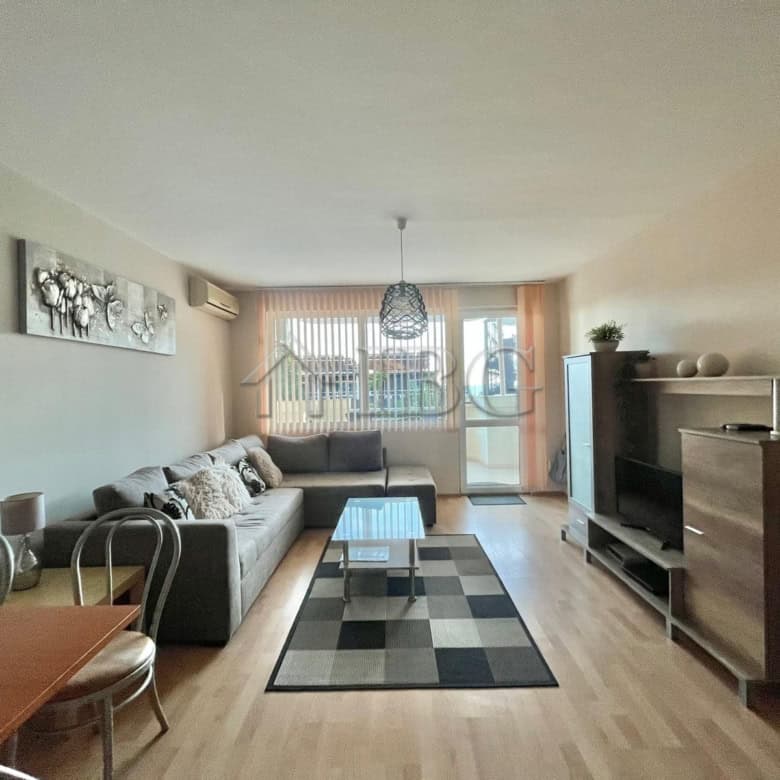 Bright living room with partial sea view in Sveti Vlas apartment.