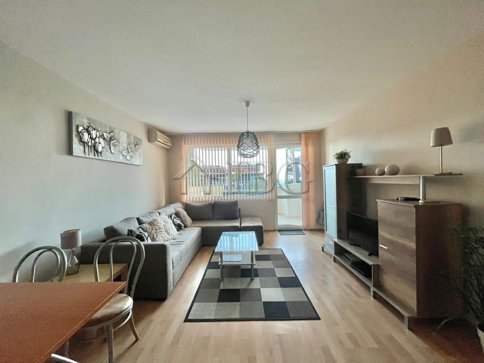 Bright living room with partial sea view in Sveti Vlas apartment.