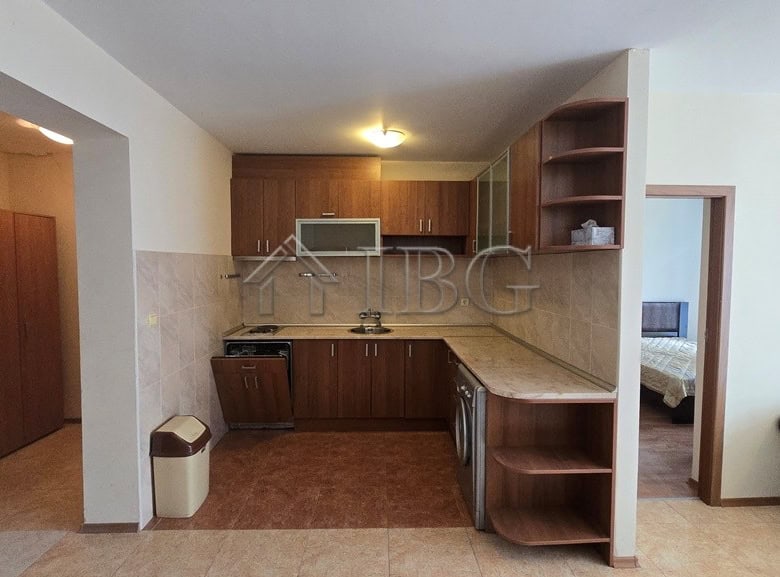 Bright 2-bedroom, 2-bathroom apartment featuring a modern kitchen and pool view in Sunny Beach.