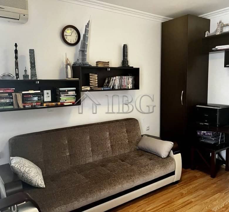 Bright living room with modern decor and bookshelf in Sveti Vlas property.