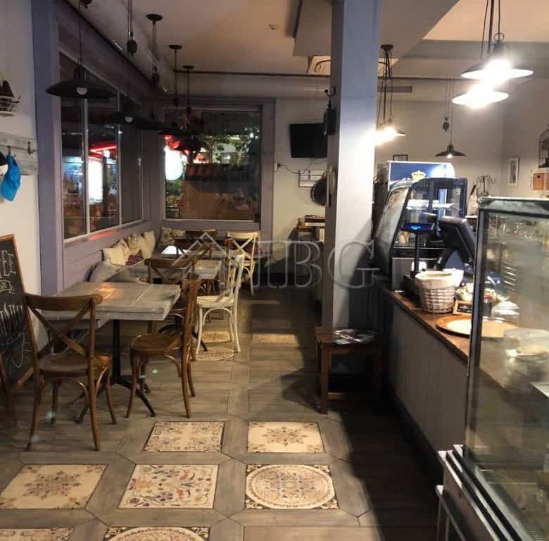 Cozy restaurant interior with wooden furniture and warm lighting in Nessebar. Perfect for dining and.