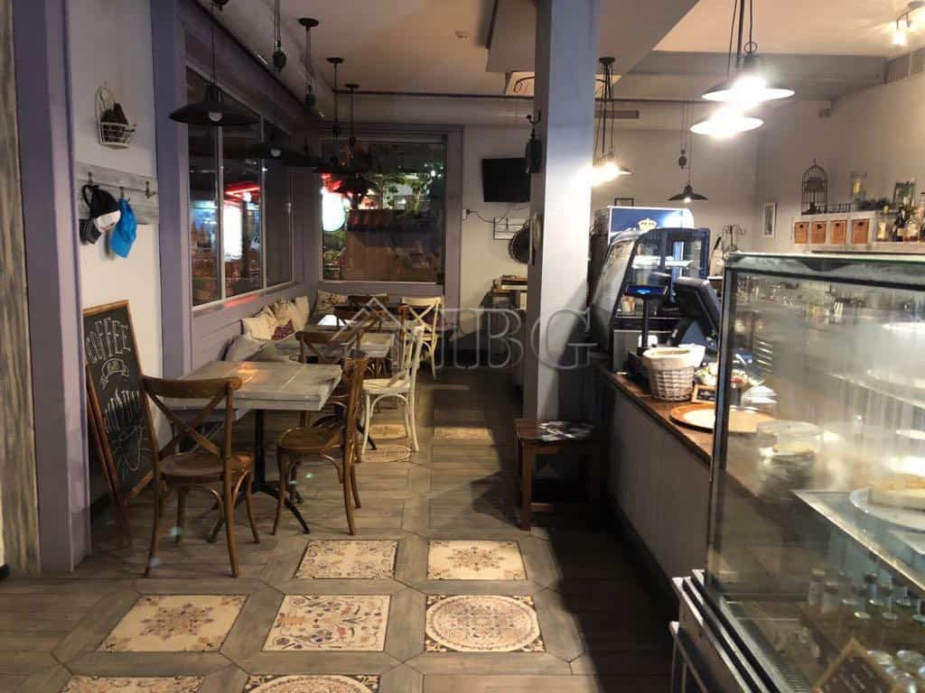 Cozy restaurant interior with wooden furniture and warm lighting in Nessebar. Perfect for dining and.
