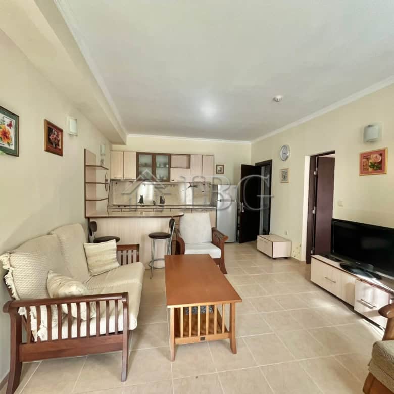 Bright living room with pool view in Saint George Palace, Sveti Vlas. Modern furnishings and open-pl.
