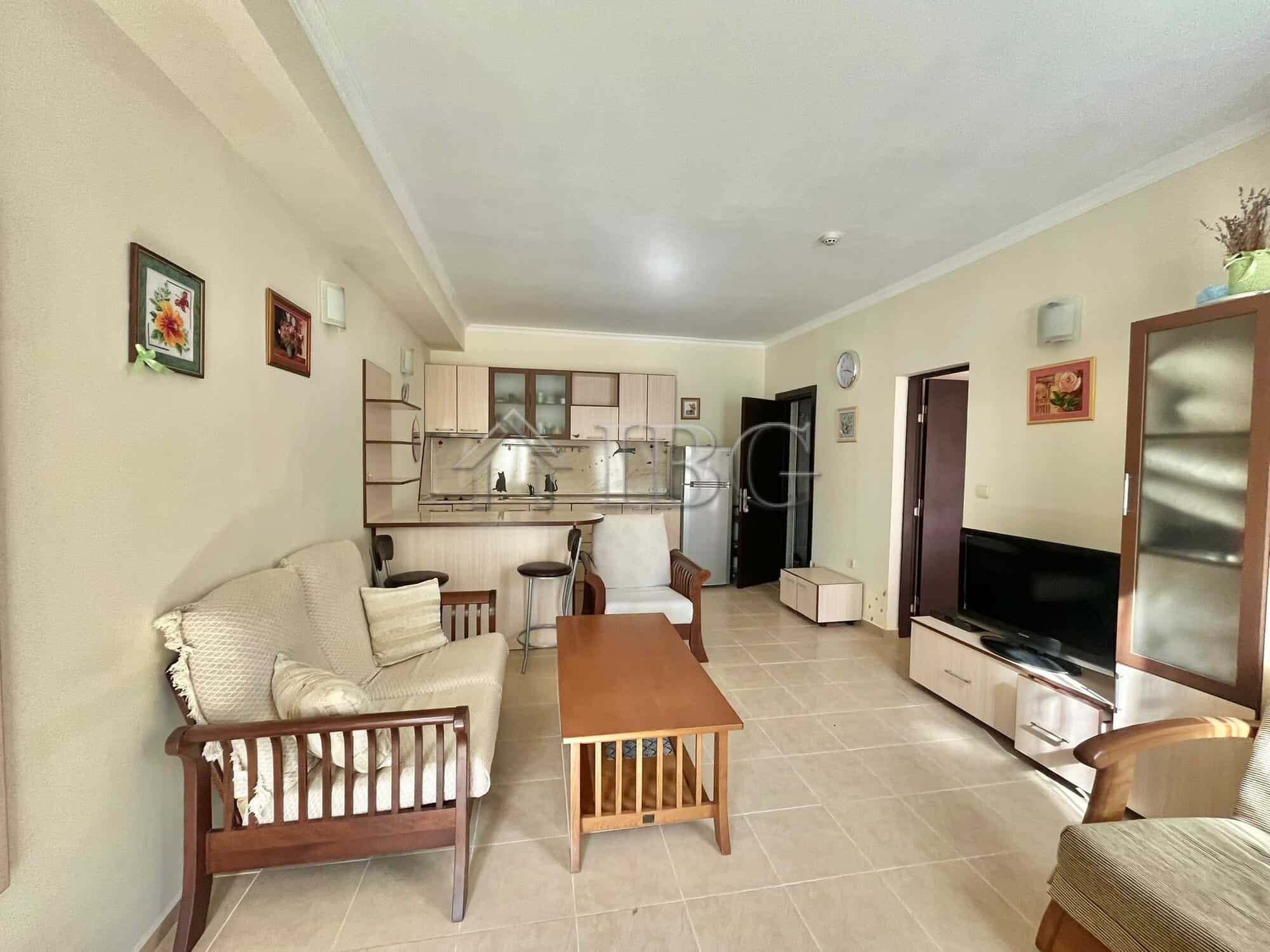 Bright living room with pool view in Saint George Palace, Sveti Vlas. Modern furnishings and open-pl.