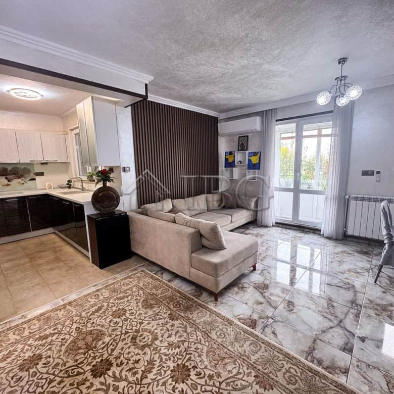 Spacious living room with sea views, modern decor, and natural light in Victoria Hill home.