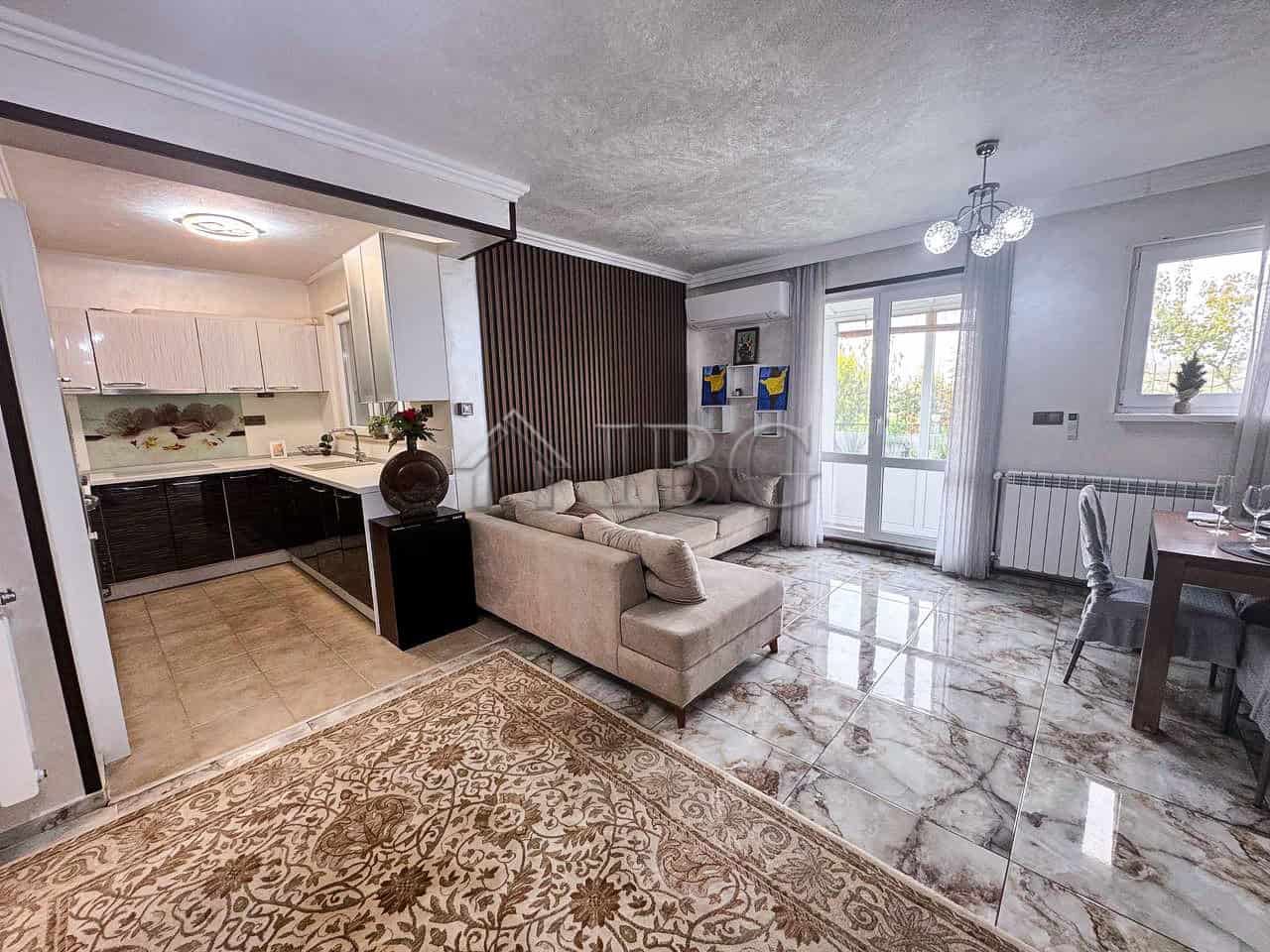 Spacious living room with sea views, modern decor, and natural light in Victoria Hill home.