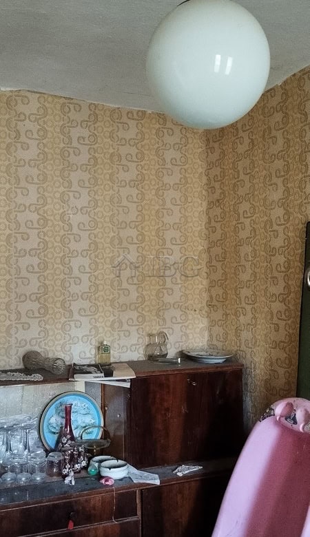 House with renovated roof and vintage interior in a peaceful village setting.