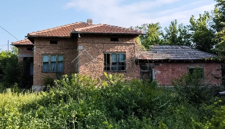 House with renovated roof and spacious garden in a peaceful village setting.