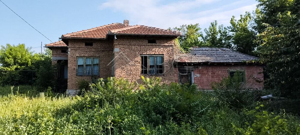 House with renovated roof and spacious garden in a peaceful village setting.