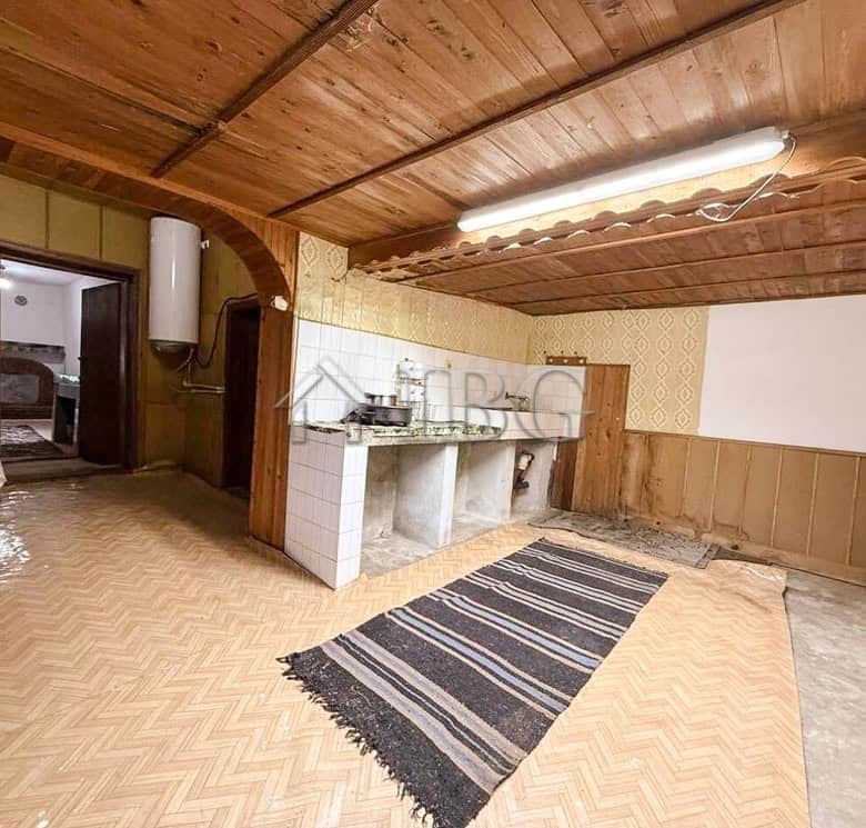 Renovated house interior with wooden ceiling and outbuildings close to the sea and General Toshevo.