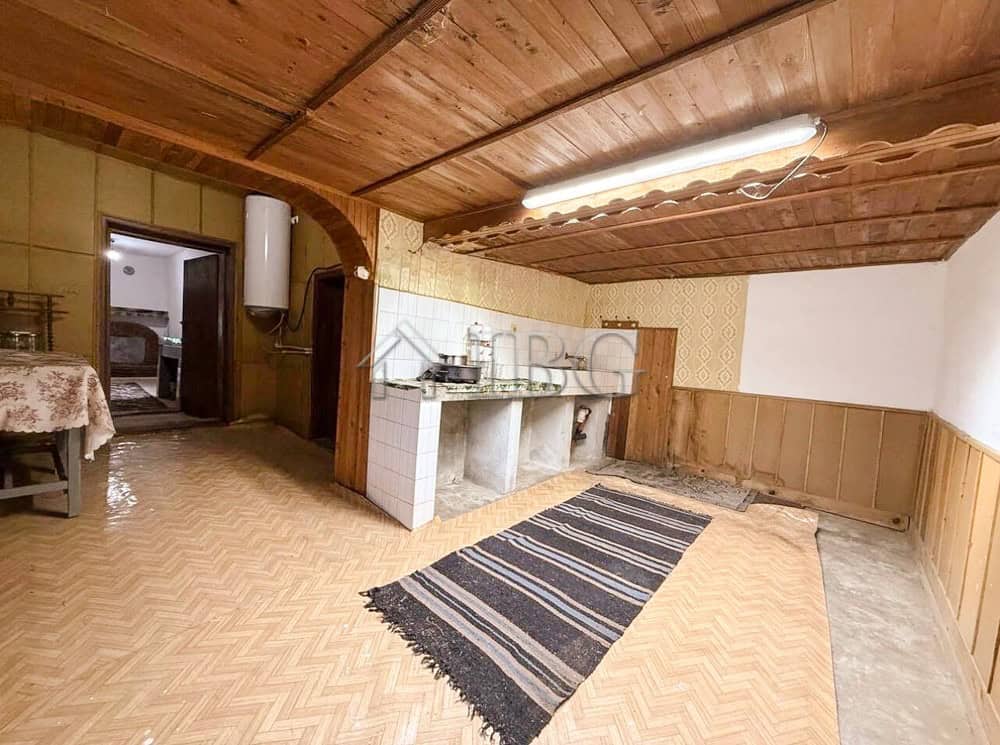 Renovated house interior with wooden ceiling and outbuildings close to the sea and General Toshevo.