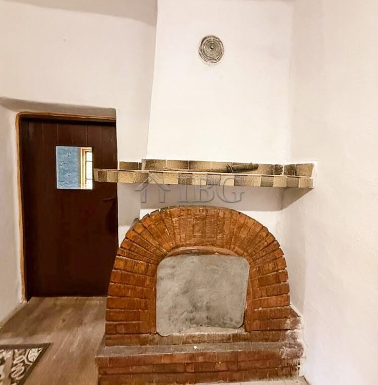 Traditional brick fireplace in a partly renovated house near the sea and General Toshevo.