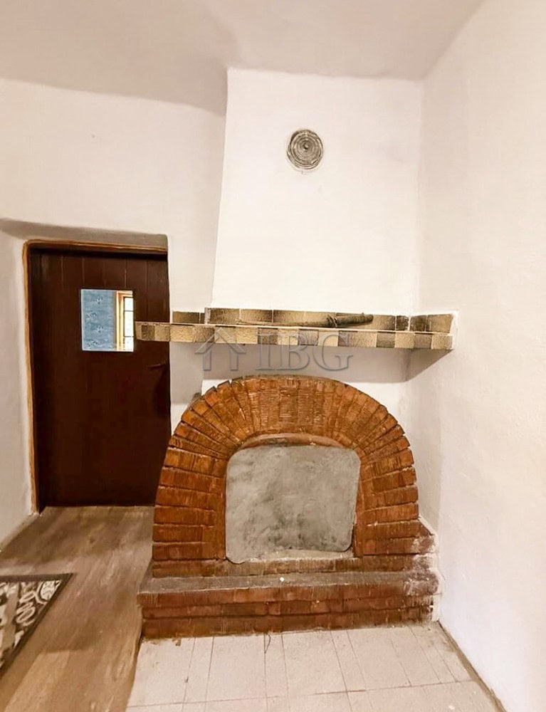Traditional brick fireplace in a partly renovated house near the sea and General Toshevo.
