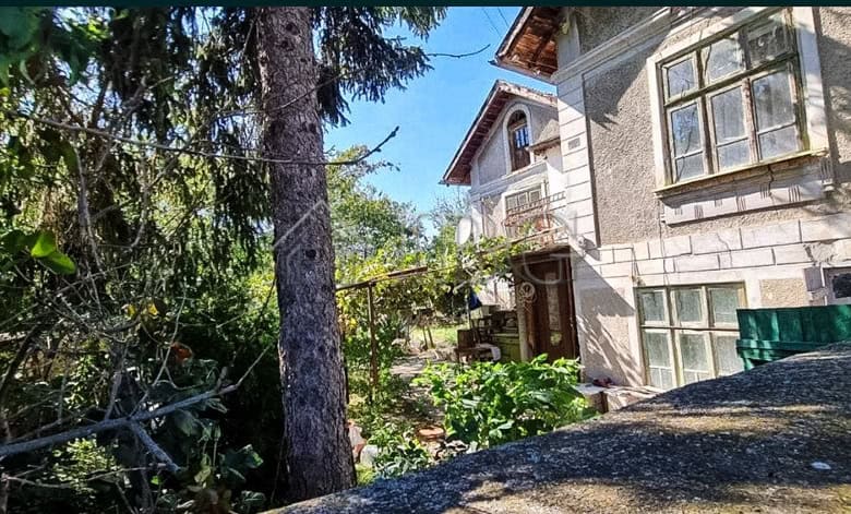 Two-storey house with lush garden and water well in Aleksandrovo village. Ideal for peaceful living.