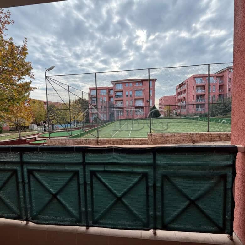 Tennis court and park view from 2-bedroom apartment in Sunny Beach on a sunny day.