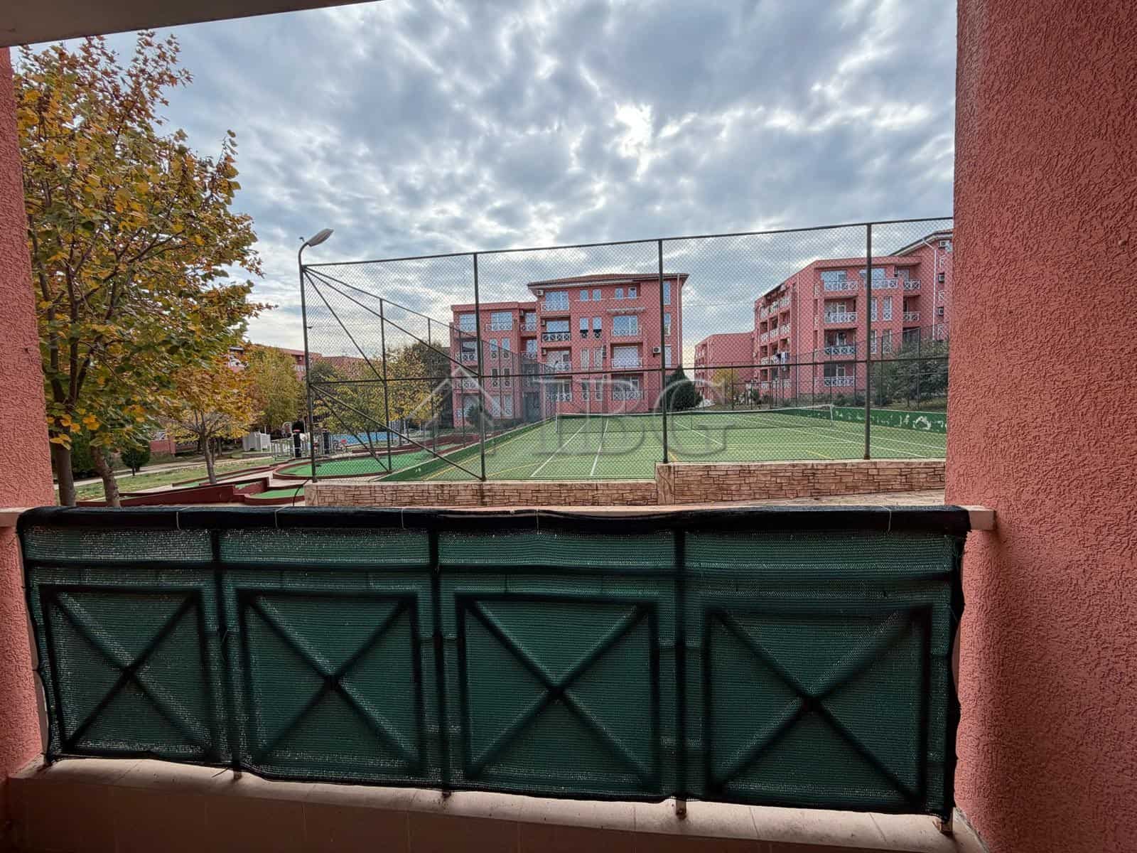Tennis court and park view from 2-bedroom apartment in Sunny Beach on a sunny day.