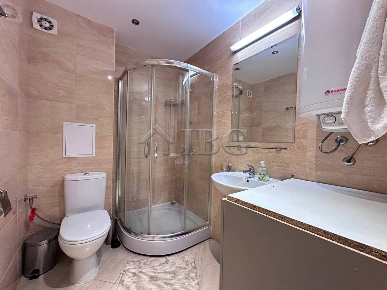 One-Bedroom Apartment in Star Dreams Complex Cozy bathroom in Star Dreams Complex, Sveti Vlas, featuring a shower, toilet, and modern fixtures.