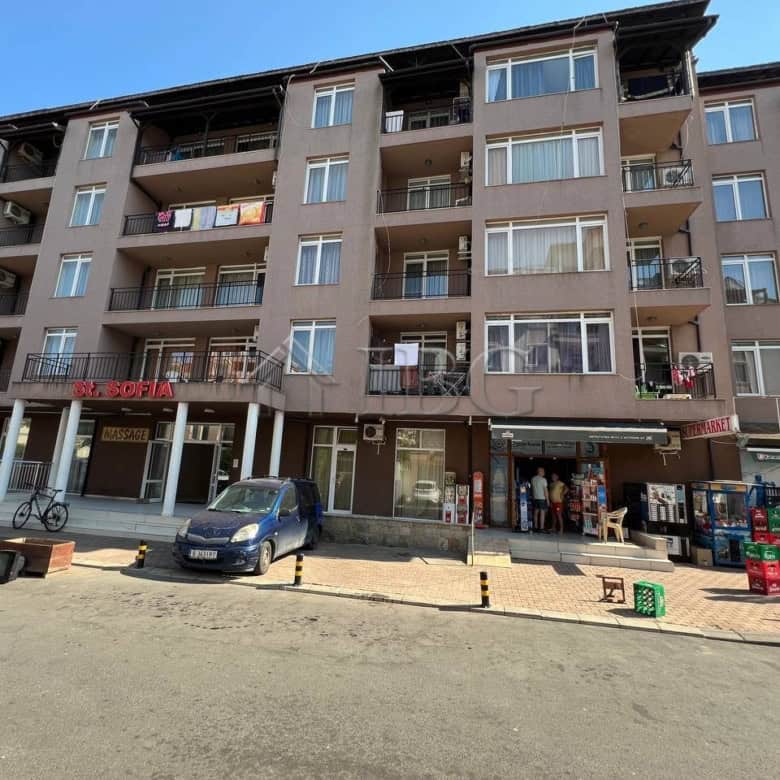 Apartment building with balconies overlooking the pool in Sunny Beach, close to the beach.