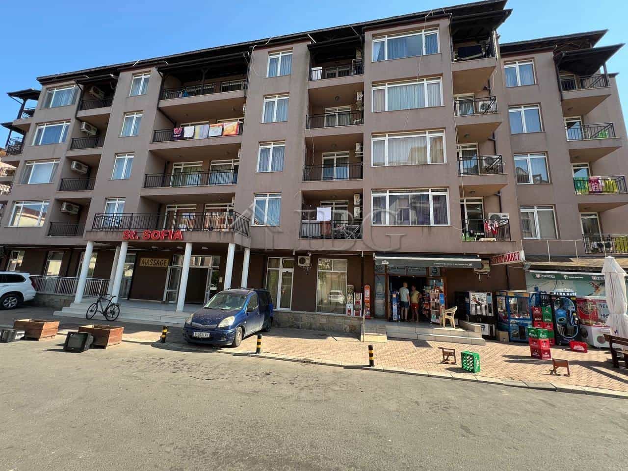 Apartment building with balconies overlooking the pool in Sunny Beach, close to the beach.