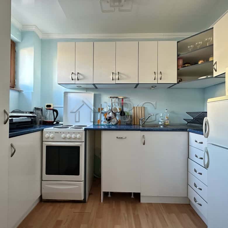 Bright kitchen in Sveti Vlas with modern appliances and ample storage space.