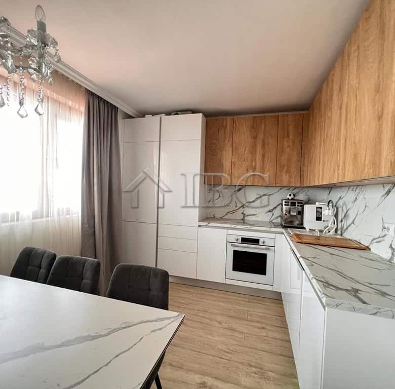 Bright kitchen with sea views, white cabinets, and marble accents in Sveti Vlas. Perfect for comfort.