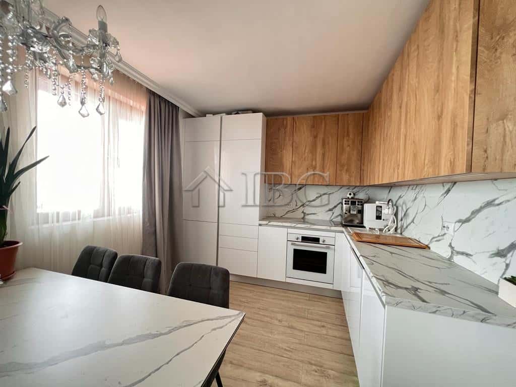 Bright kitchen with sea views, white cabinets, and marble accents in Sveti Vlas. Perfect for comfort.