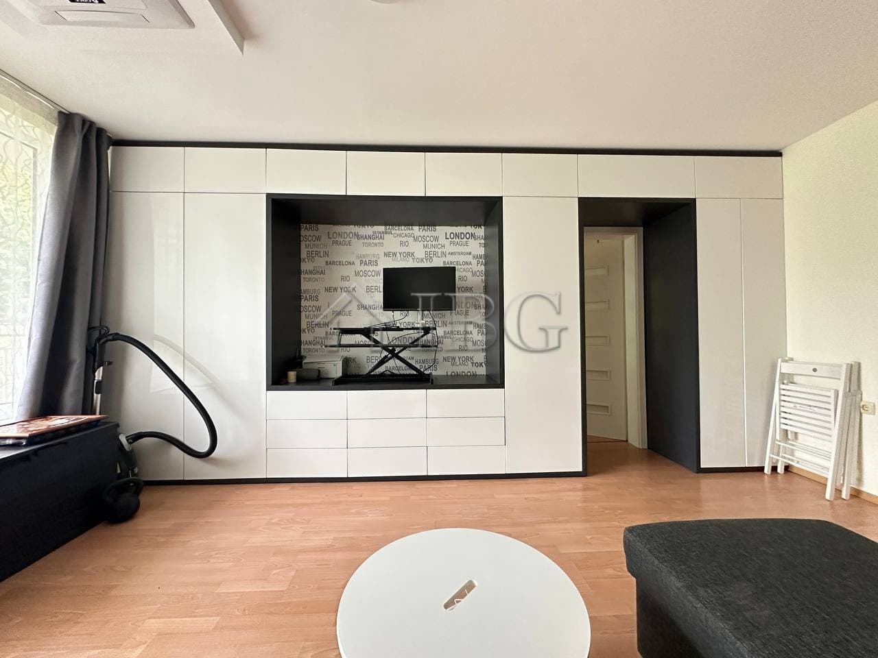 Bright 1-bedroom apartment with garden view in Sveti Vlas, featuring a sleek living area and contemp.