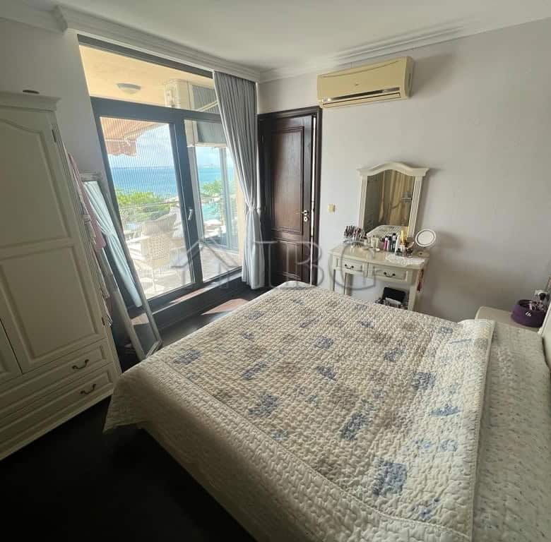 Sea view two-bedroom apartment in Sveti Vlas with modern furnishings and balcony access. Perfect for.