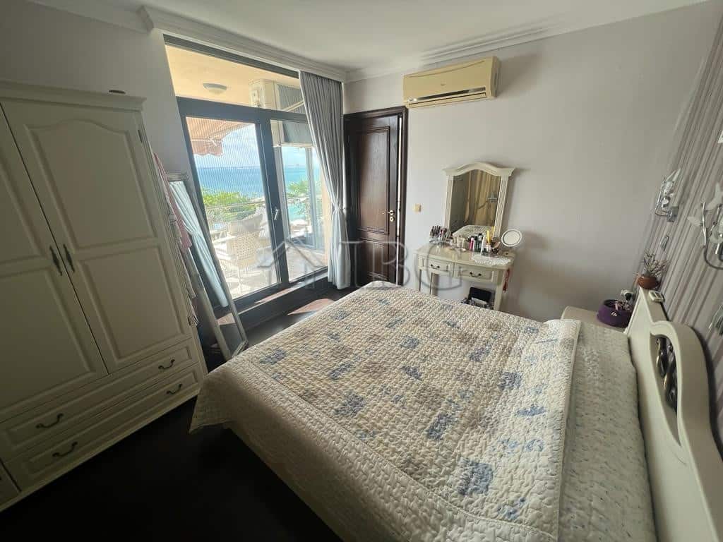 Sea view two-bedroom apartment in Sveti Vlas with modern furnishings and balcony access. Perfect for.