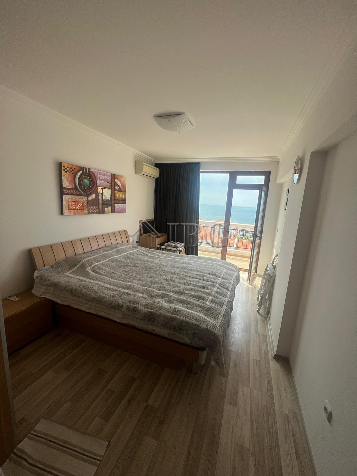 Sea view bedroom in Sveti Vlas with balcony access and natural light.