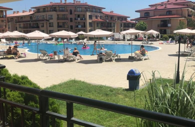 Pool with sun loungers and umbrellas at Star Dreams resort, Sveti Vlas, close to the sea.